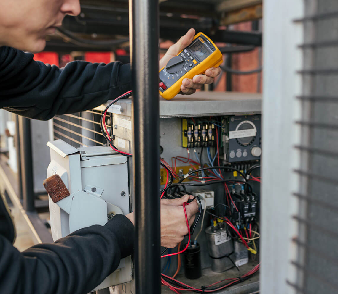 TempChek repairman assessing accuracy of refrigeration equipment of a commercial business